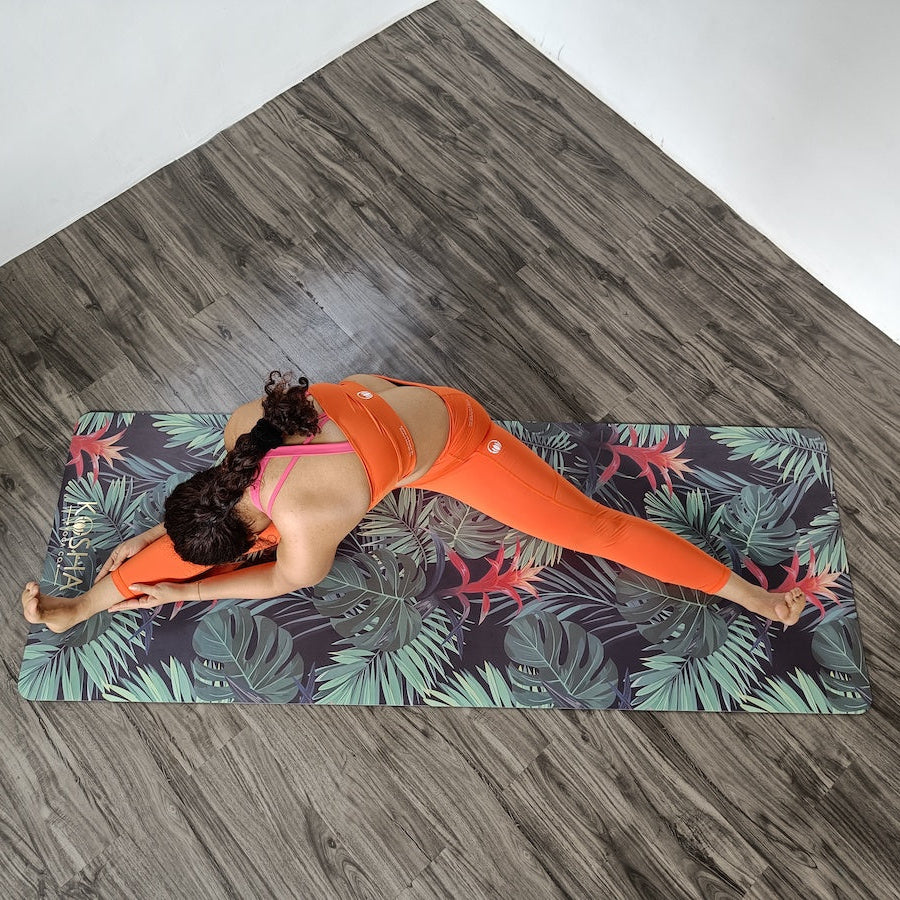 Yoga Teacher on tropical print mat by kosha yoga co
