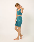 Green Sustainable activewear made out of recycled materials by Kosha Yoga Co. Squat proof, stretchable biker shorts for yoga, gym, workouts, running.