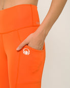 Orange yoga shorts with pockets by kosha yoga co