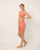 Pink Biker shorts and sports bra for yoga, gym, workouts, running made by kosha yoga co from recycled materials