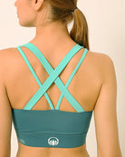 Green sports bra and shorts co-ord set with contrast straps for yoga, gym, workouts, running made by kosha yoga co from recycled materials