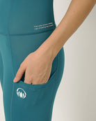 Green moisture wicking yoga pants with two pockets by Kosha yoga co