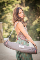 Waterproof yoga mat bag with two pockets that fits all yoga mats