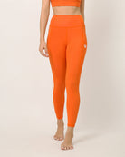 Orange ankle length leggings for yoga and sports bra set by kosha yoga co