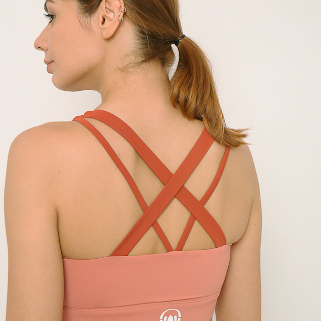 Pink and rust sports bra and shorts co-ord set with contrast straps for yoga, gym, workouts, running made by kosha yoga co from recycled materials
