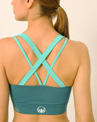 Green sports bra co-ord set with contrast straps for yoga, gym, workouts, running made by kosha yoga co from recycled materials