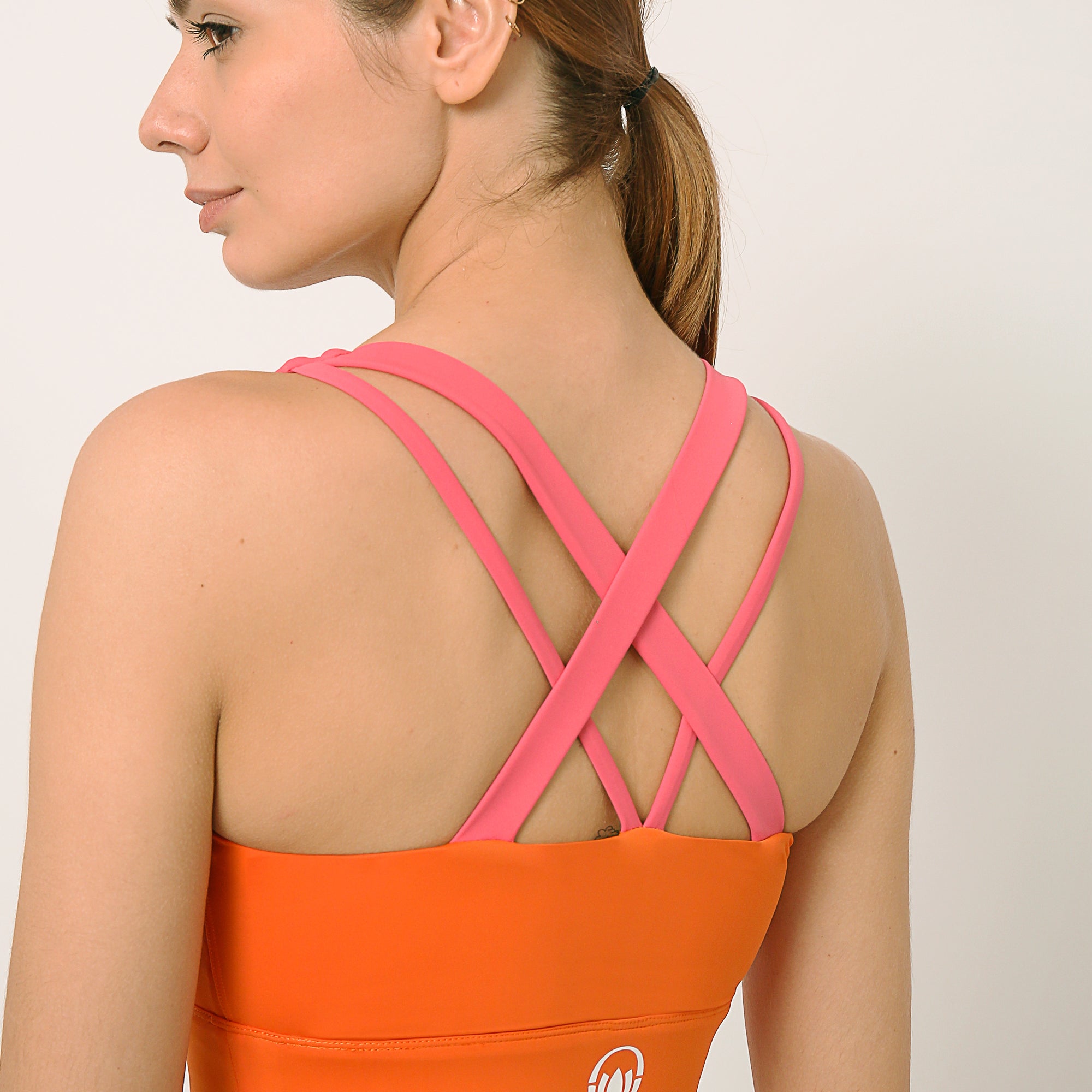 Orange and pink sports bra co-ord set with contrast straps for yoga, gym, workouts, running made by kosha yoga co from recycled materials