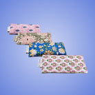 Set of colorful floral-patterned pouches on a blue Aromatherapy wellness kit by kosha yoga in Blue colour print