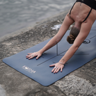 blue yoga mat with alignment lines and natural rubber for extra grip