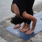 dark blue yoga mat with alignment lines and natural rubber for extra grip