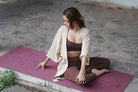 Kosha Yoga Purple Merlot Yoga Mat Teacher sitting on mat in Mysore