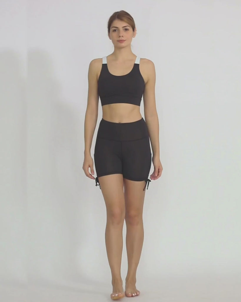 Black yoga shorts from recycled materials by Kosha Yoga Co. Squat proof, stretchable shorts for yoga, gym, workouts, running.