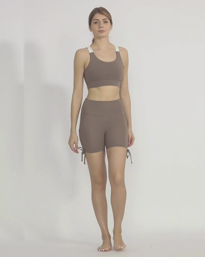 Nude yoga shorts from recycled materials by Kosha Yoga Co. Squat proof, stretchable shorts for yoga, gym, workouts, running.