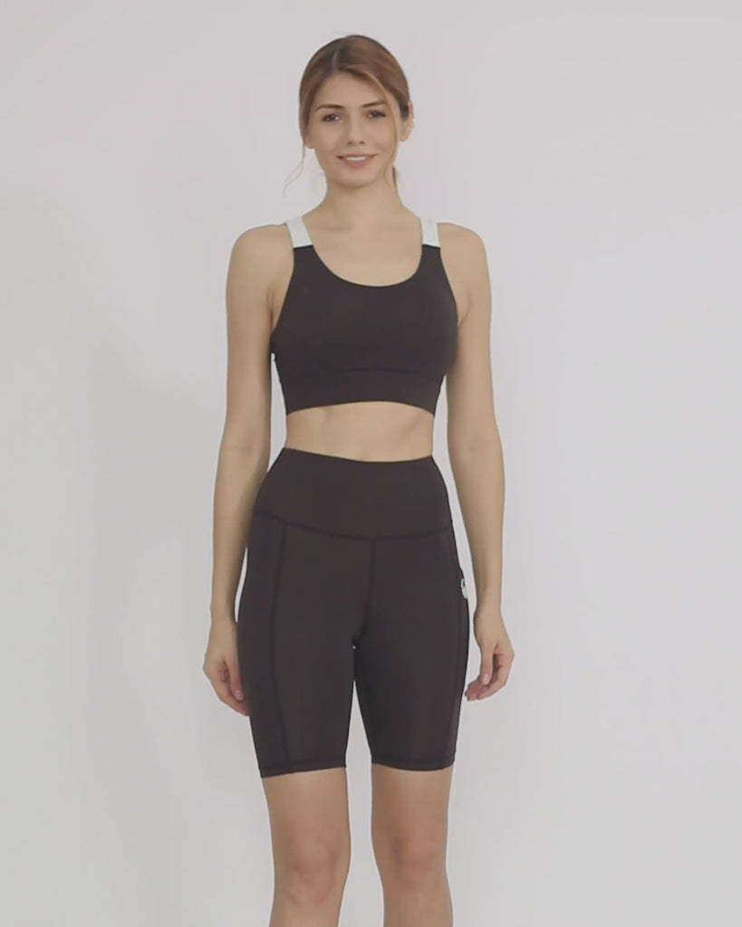 Black Sustainable activewear made out of recycled materials by Kosha Yoga Co. Squat proof, stretchable biker shorts for yoga, gym, workouts, running.