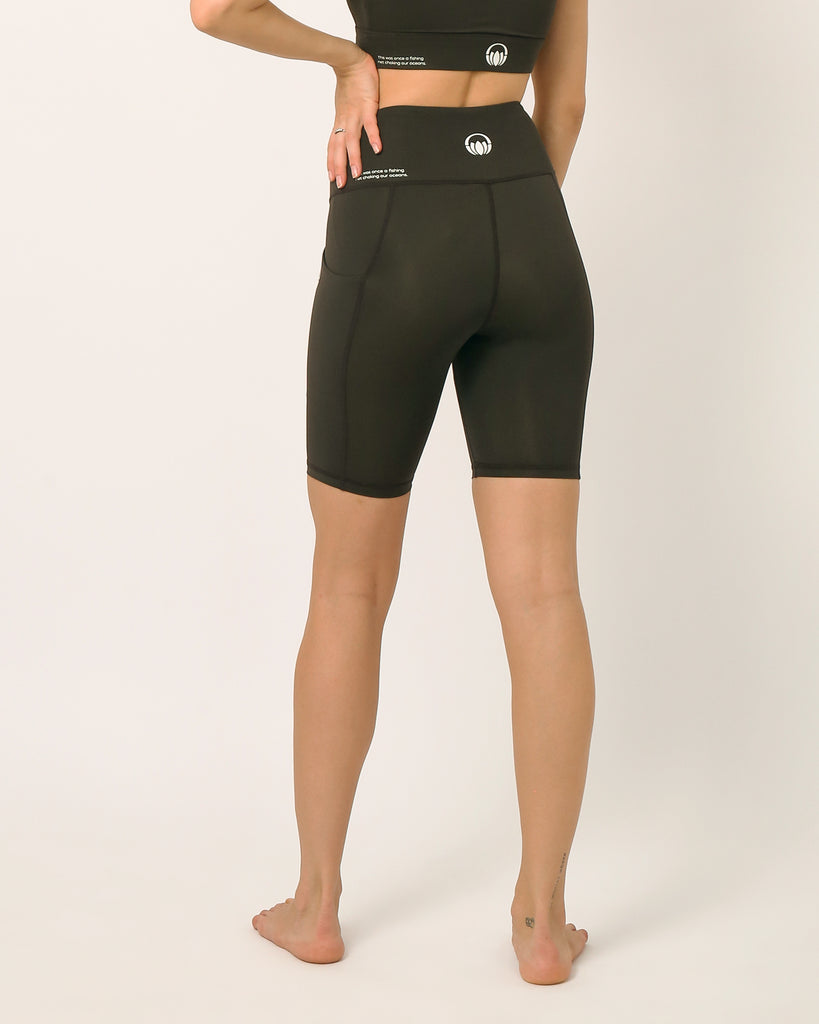 Black knee length shorts for yoga and sports bra yoga set by kosha yoga co
