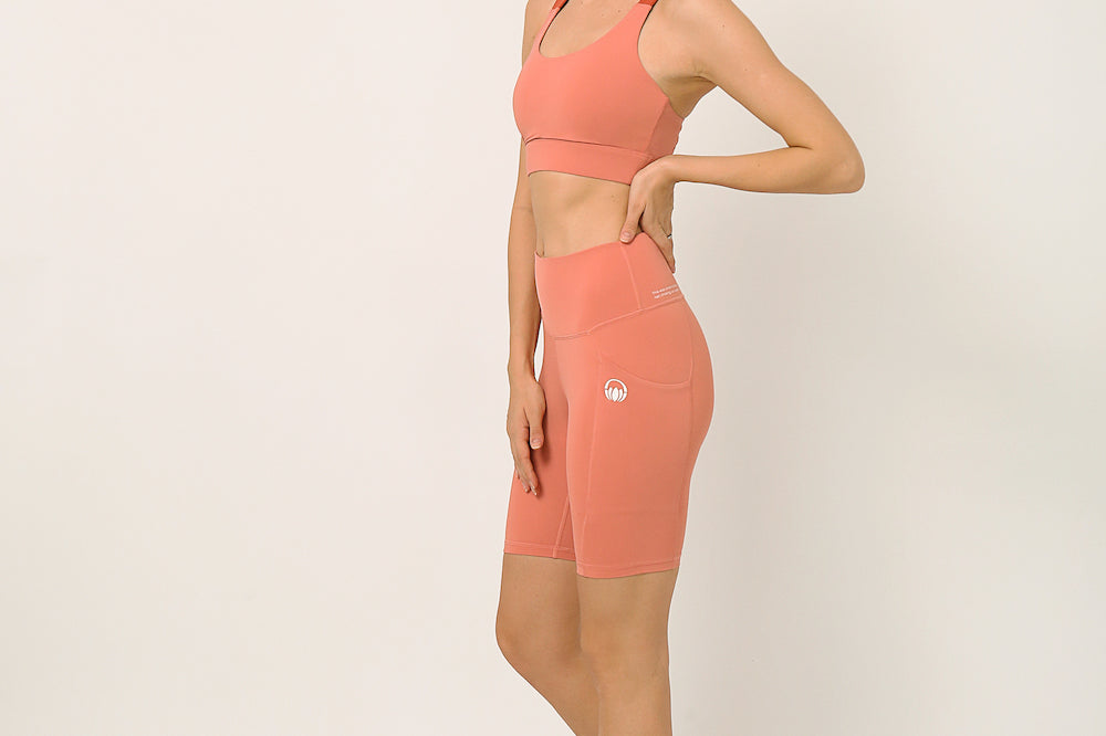 Pink Biker shorts and sports bra for yoga, gym, workouts, running made by kosha yoga co from recycled materials