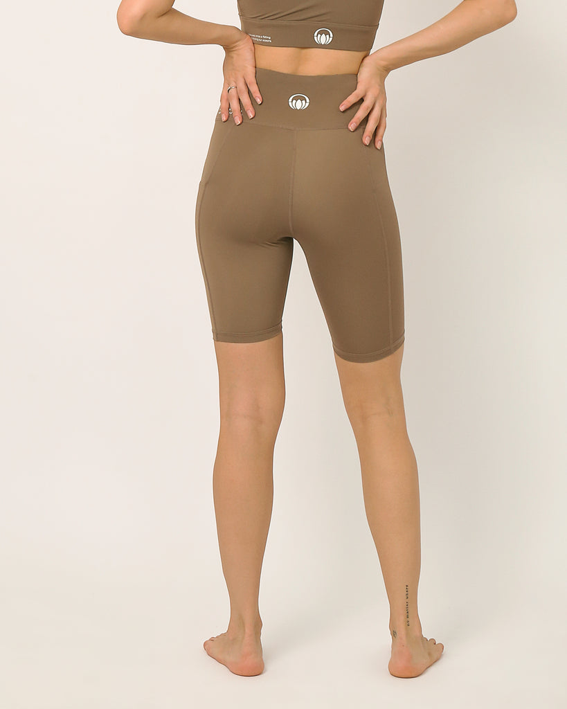 Nude knee length shorts for yoga and sports bra yoga set by kosha yoga co