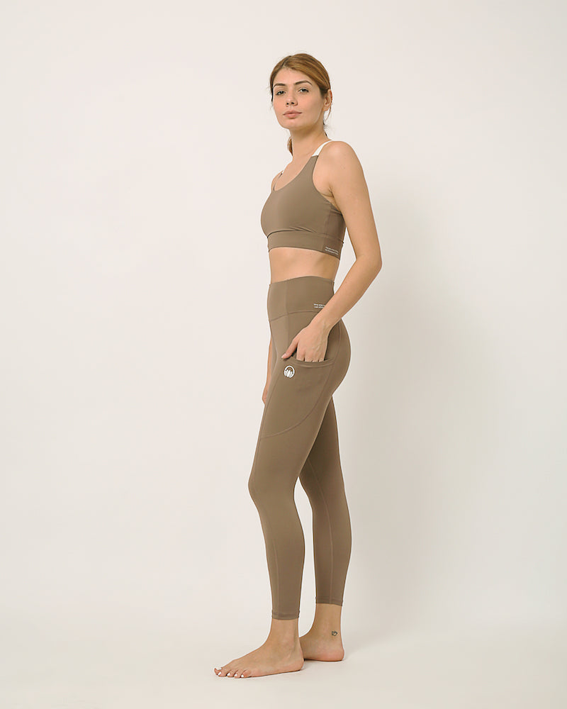 Nude yoga pants and sports bra for yoga, gym, workouts, running made by kosha yoga co from recycled materials
