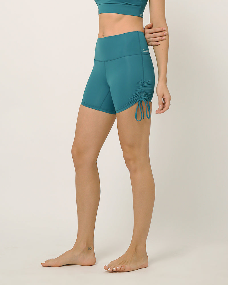 Green moisture wicking shorts with adjustable length by kosha yoga co