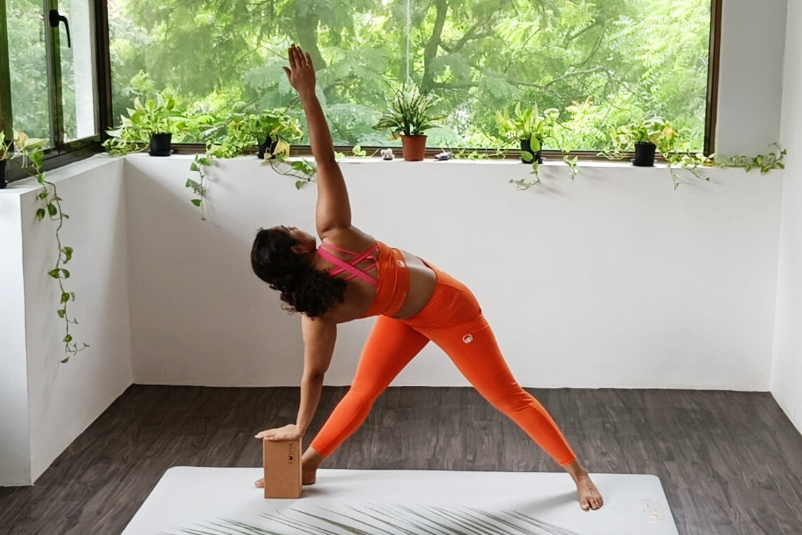 Yoga Teacher on tropical print mat by kosha yoga co 
