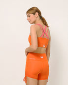 Yoga set with sports bra and shorts by kosha yoga co in orange