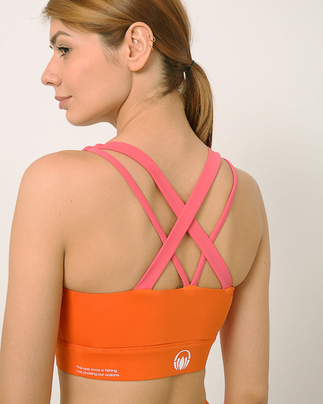 Orange and pink  sports bra and shorts co-ord set with contrast straps for yoga, gym, workouts, running made by kosha yoga co from recycled materials