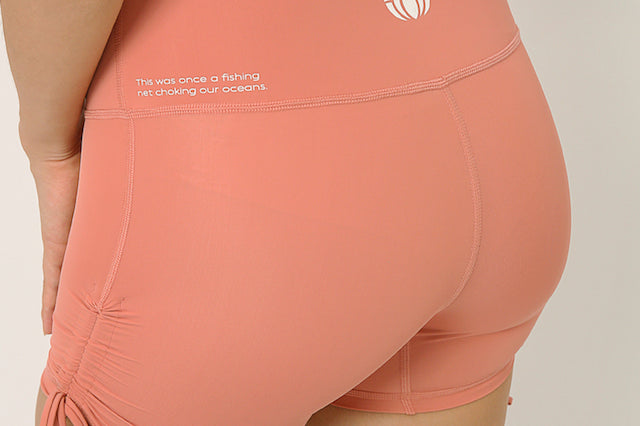 Pink  squat proof shorts with adjustable length for yoga and sports bra yoga set by kosha yoga co