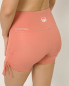 Pink  squat proof shorts with adjustable length for yoga and sports bra yoga set by kosha yoga co