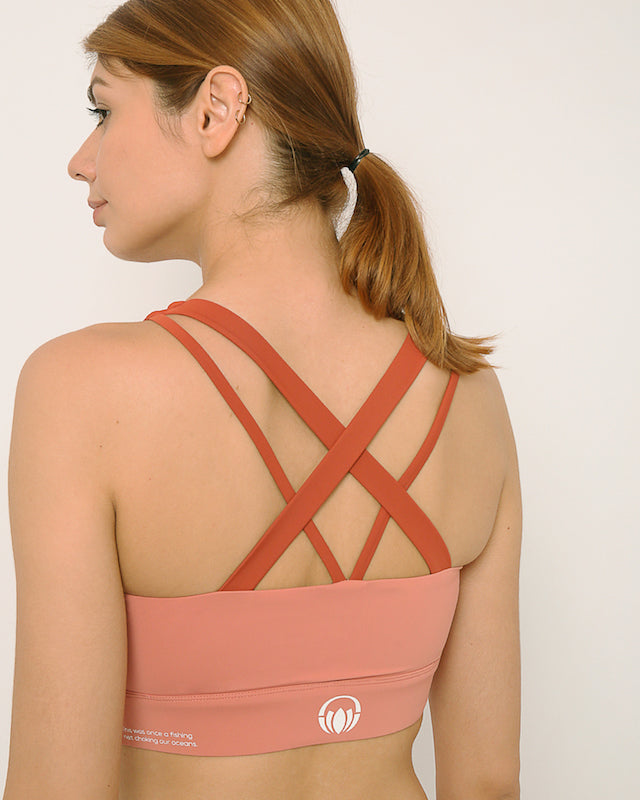 Pink and rust sports bra and shorts co-ord set with contrast straps for yoga, gym, workouts, running made by kosha yoga co from recycled materials