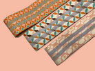pink white green orange printed non slip fabric resistance bands by kosha yoga co