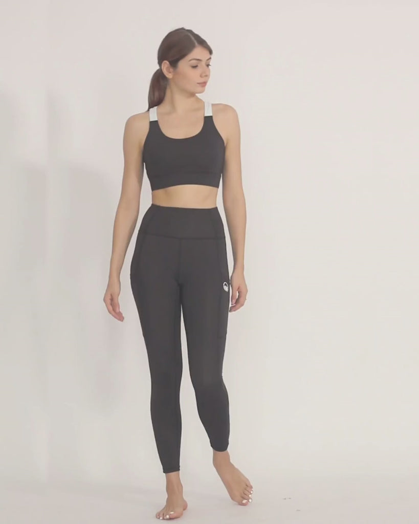 Black yoga pants and sports bra co-ord set by kosha yoga co from recycled materials