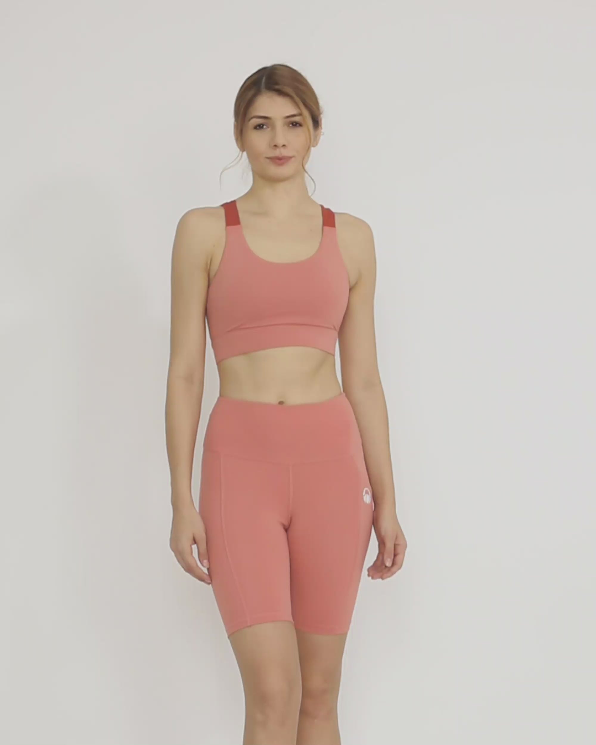 Pink Sustainable activewear made out of recycled materials by Kosha Yoga Co. Squat proof, stretchable biker shorts for yoga, gym, workouts, running.